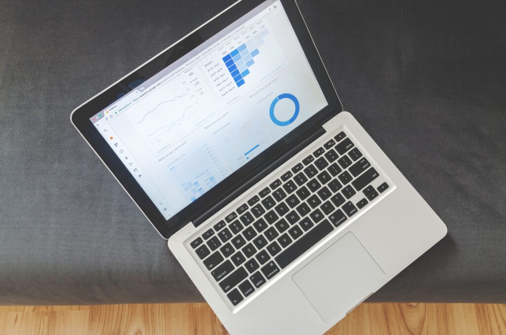 Laptop showing business data charts, representing an ERP system dashboard